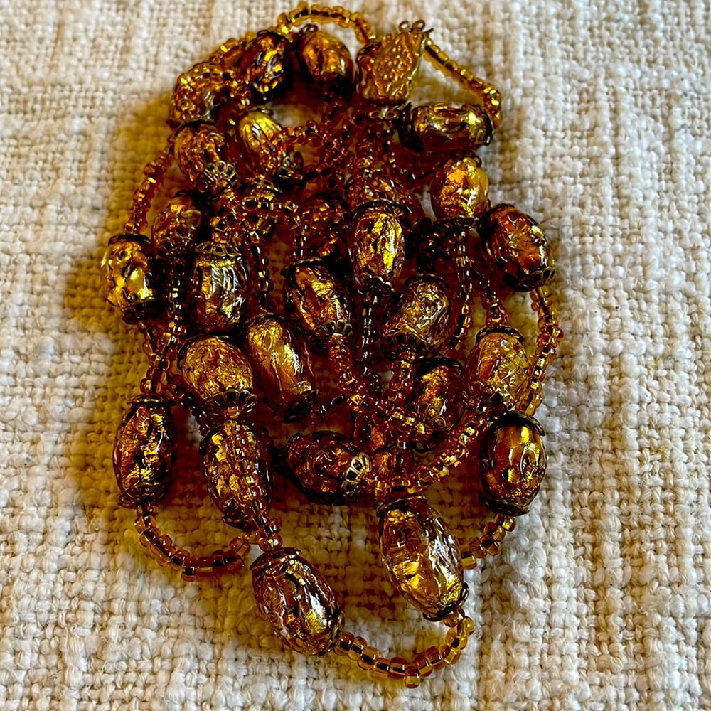 Gold tone string of beads. 25” long.  No extender. Vintage